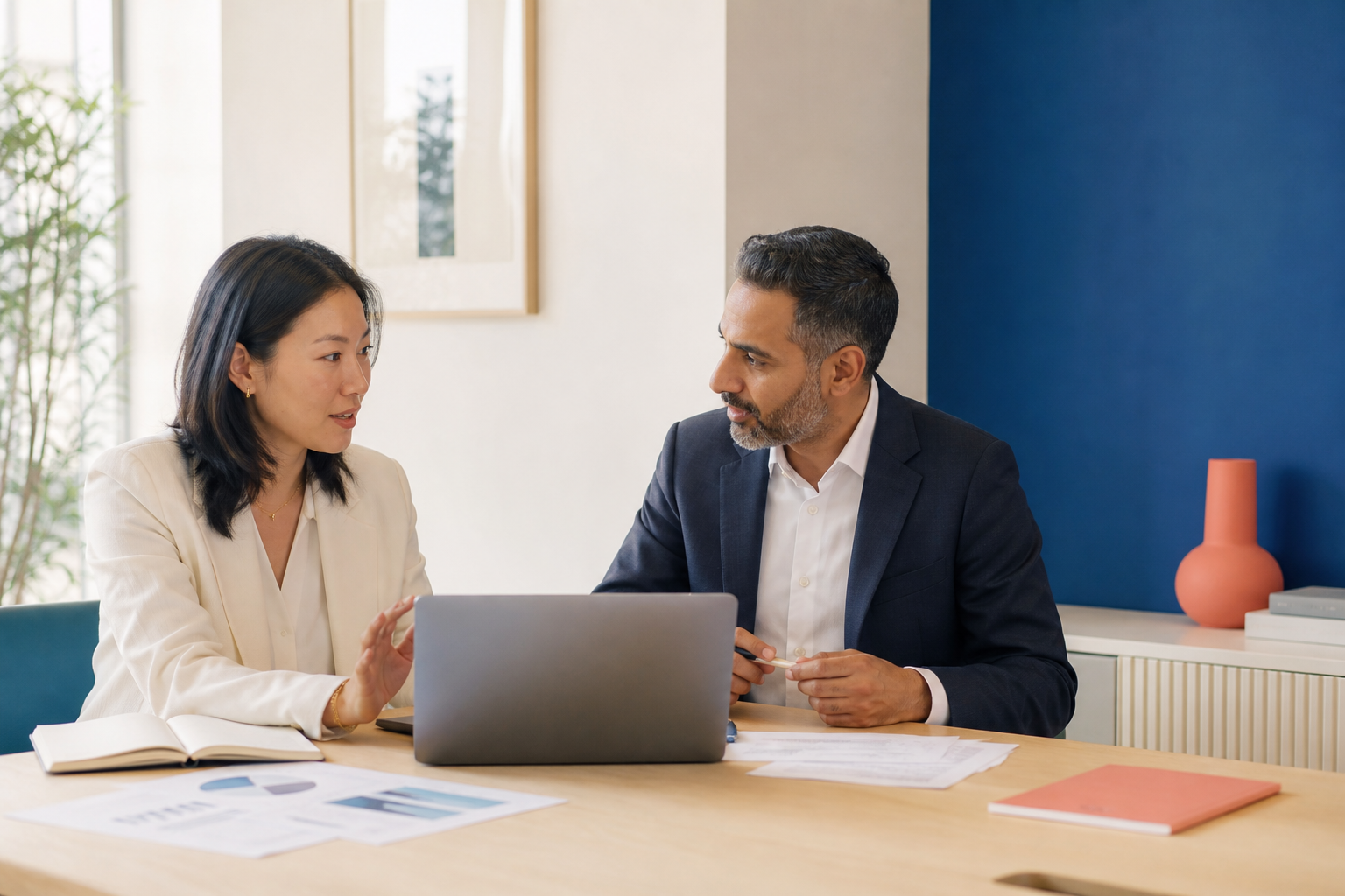 Business leaders discussing a hiring plan in a contemporary office